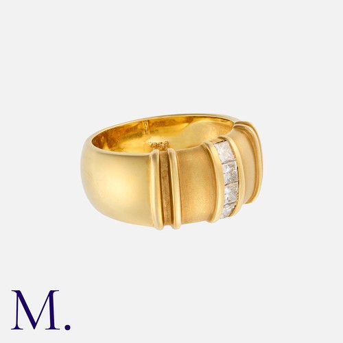 66 - A Diamond Band in 18K yellow gold, with four princess cut diamonds weighing approximately 0.20ct in ... 