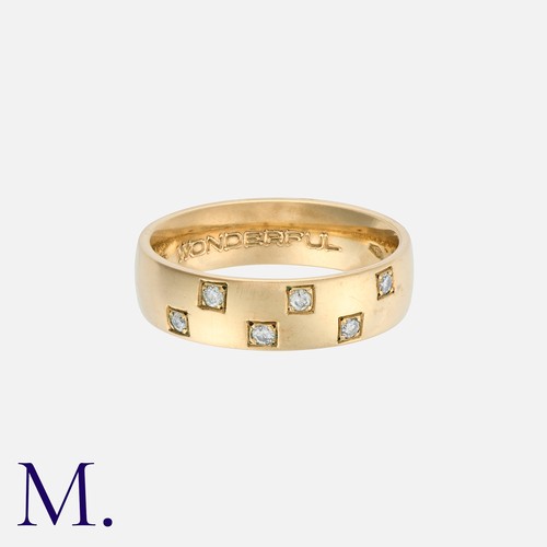 176 - A Diamond Band in 9K gold set with 6 diamonds weighing approximately 0.12ct in total.

Size: K
Weigh... 