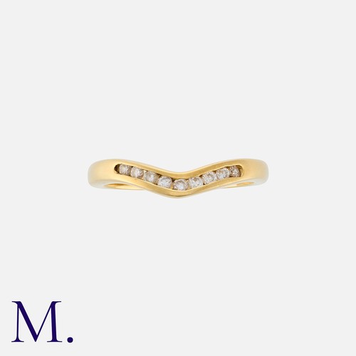 187 - A Diamond Band in chevron style in 18K yellow gold, set with nine round cut diamonds weighing approx... 