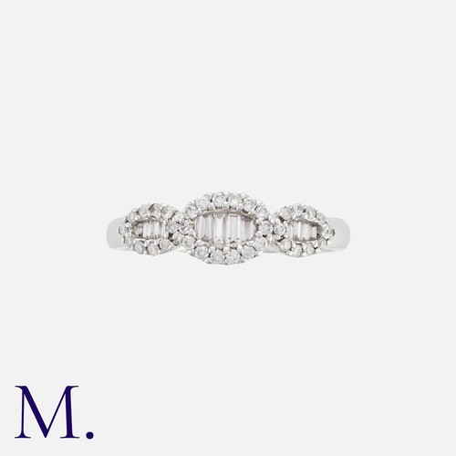 235 - A Diamond Ring in 14K white gold, set with round and tapered baguette cut diamonds weighing approx. ... 