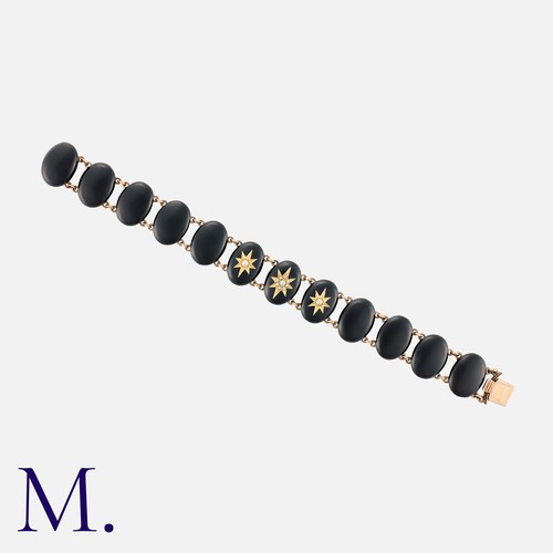 210 - A Victorian Mourning Bracelet in 9ct gold, with polished oval onyx panels (each is 17x12mm) linked b... 