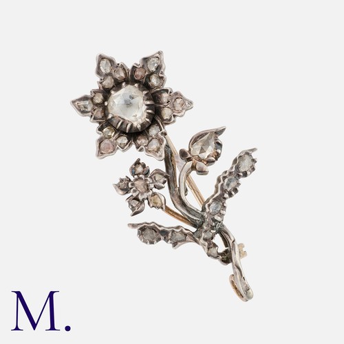 119 - A Rose Diamond Flower Brooch in yellow gold and silver, set with rose cut diamonds.

Size: 4.5cm
Wei... 