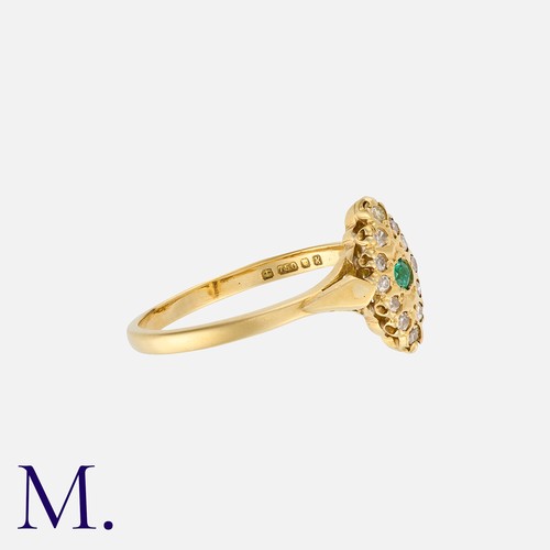 67 - An Emerald and Diamond Ring in 18K yellow gold, set with a round cut emerald with diamond accents to... 