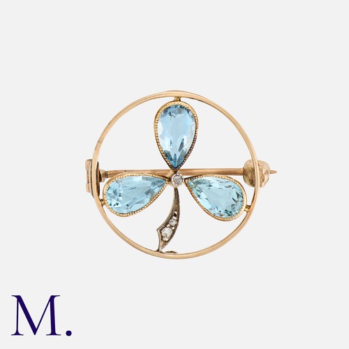 63 - An Antique Aquamarine and Diamond Brooch in yellow gold with a three-leaf shamrock design set with p... 