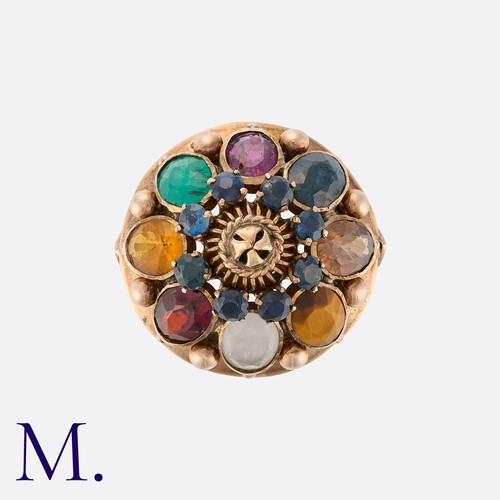 238 - A Multi-Gem Set Ring in 14k yellow gold, the domed body set with a variety of gemstones. Stamped 14k... 