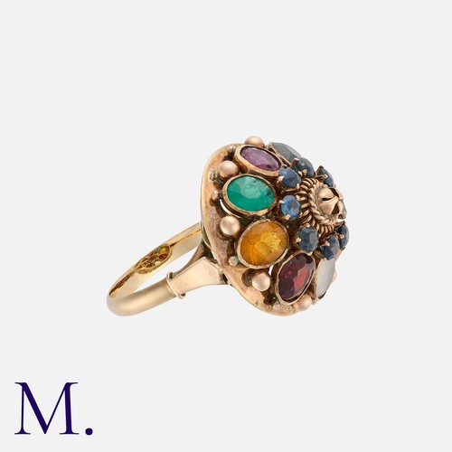 238 - A Multi-Gem Set Ring in 14k yellow gold, the domed body set with a variety of gemstones. Stamped 14k... 