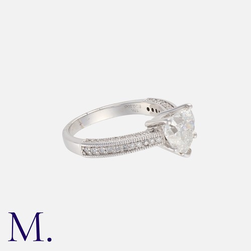 79 - A Diamond Ring in 18k white gold, set with a principal heart shaped diamond of 2.01cts, with further... 