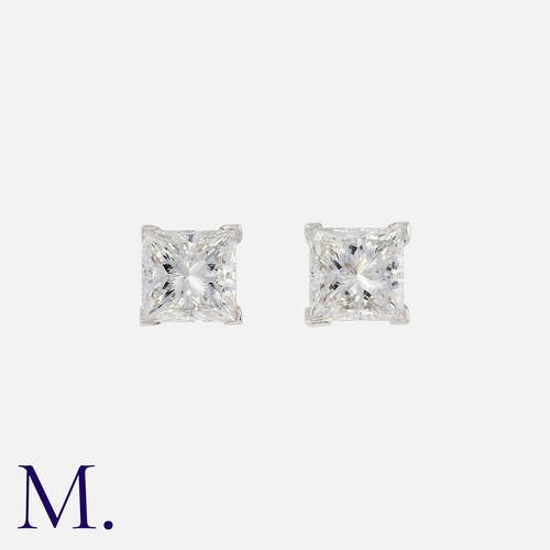 92 - A Pair Of Diamond Stud Earrings in 18k white gold, each comprising a princess cut diamond of 0.80cts... 