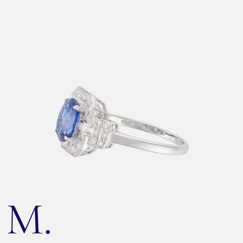 78 - A Sapphire And Diamond Ring in 18k white gold, set with a principal oval sapphire of approximately 1... 