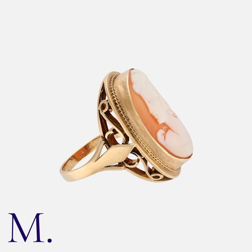 60 - A Cameo Ring in 9k yellow gold, set with a shell cameo depicting a woman in profile. Unmarked but te... 