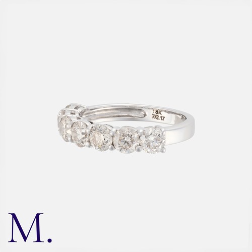 28 - A Diamond Seven Stone Ring in 18k white gold, set with seven round cut diamonds totalling approximat... 