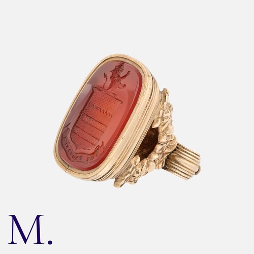 205 - A Carnelian Seal in yellow gold, a large carnelian stone with carved intaglio crest and Latin motto ... 