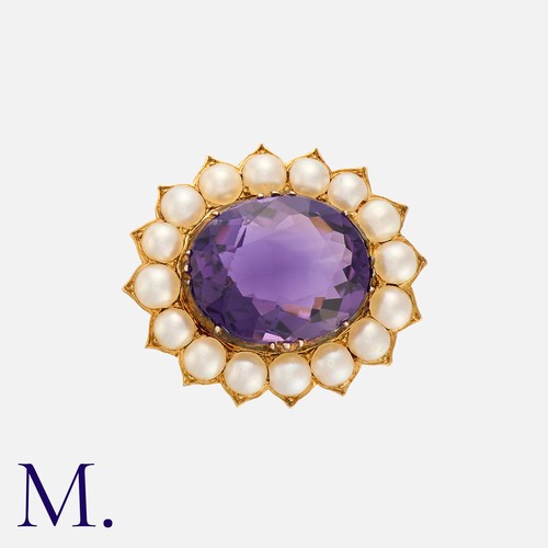 183 - An Antique Amethyst and Pearl Brooch in yellow gold, set with a deep purple amethyst to the centre i... 