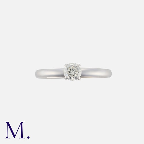 151 - DAVID MORRIS. A Diamond Solitaire Ring in 18K white gold, set with a round brilliant diamond weighin... 