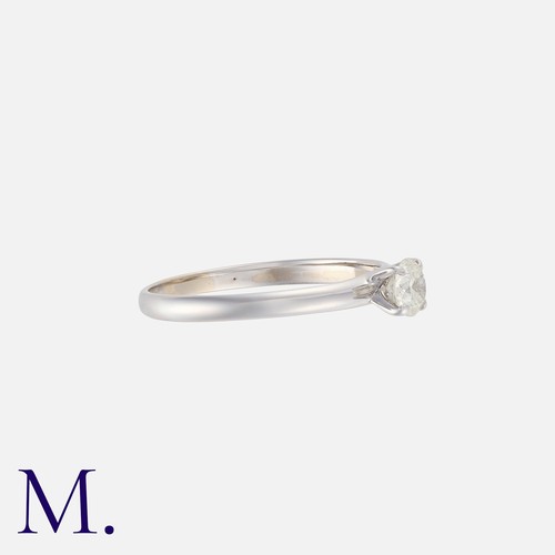 151 - DAVID MORRIS. A Diamond Solitaire Ring in 18K white gold, set with a round brilliant diamond weighin... 