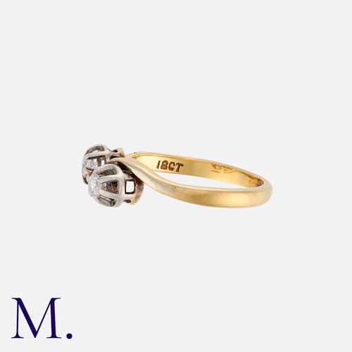 27 - A Diamond Toi et Moi Ring in yellow gold, set with two round cut diamonds weighing approximately 0.1... 