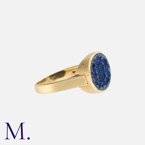 180 - An Intaglio Signet Ring in yellow gold, set with a blue stone with armorial intaglio.  Stamped 585 f... 