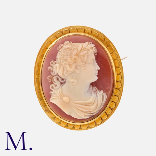 97 - A Victorian Cameo Brooch in yellow gold, a carved hardstone cameo depicting the bust of a female in ... 