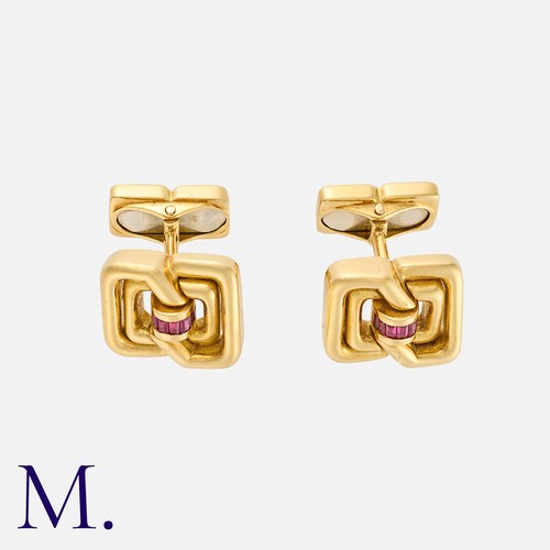 16 - TIFFANY & CO. A Pair of Cufflinks in 18K yellow gold set with calibrated rubies with a geometric des... 