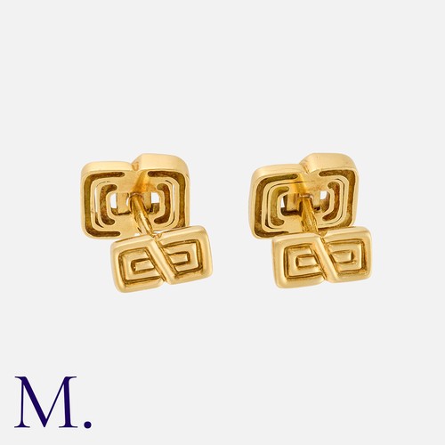 16 - TIFFANY & CO. A Pair of Cufflinks in 18K yellow gold set with calibrated rubies with a geometric des... 