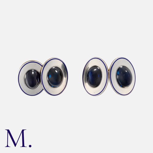 133 - A Pair of Sapphire Cufflinks, each set with a large cabochon sapphire to a platinum face with additi... 