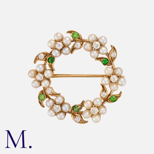 104 - An Antique Pearl, Diamond and Demantoid Garnet Brooch in yellow gold, set with six flower clusters, ... 