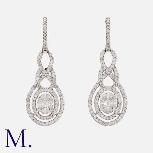 108 - A Pair of Diamond Earrings in white gold, set with marquise, baguette and round brilliant-cut diamon... 