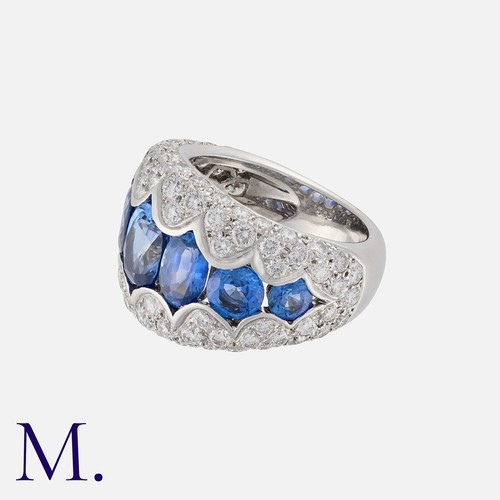 158 - A Sapphire and Diamond Ring in 18K white gold, set with round cut sapphires weighing approx. 5.0ct i... 