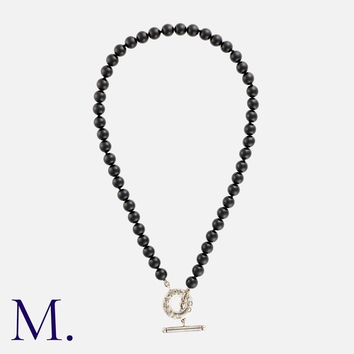 1 - NO RESERVE. TIFFANY & CO. An Onyx Toggle Necklace in silver, with onyx beads terminating in a silver... 