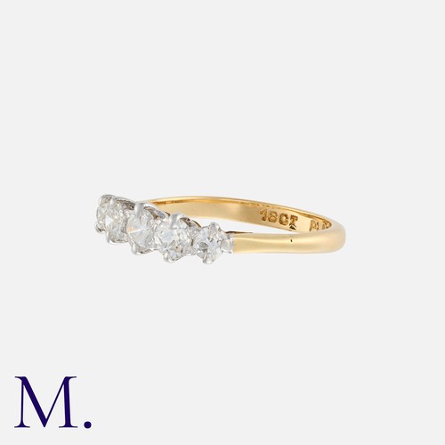 21 - A Vintage Diamond Five Stone Ring in 18k yellow gold and platinum, principally set with a round bril... 