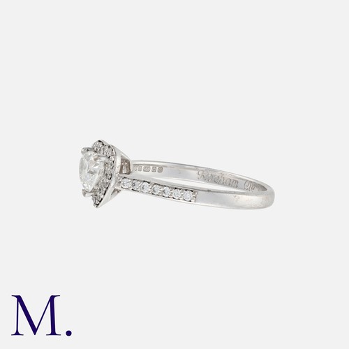 41 - A Diamond Ring in 18k white gold, set with a heart shaped diamond of approximately 0.40cts, within a... 