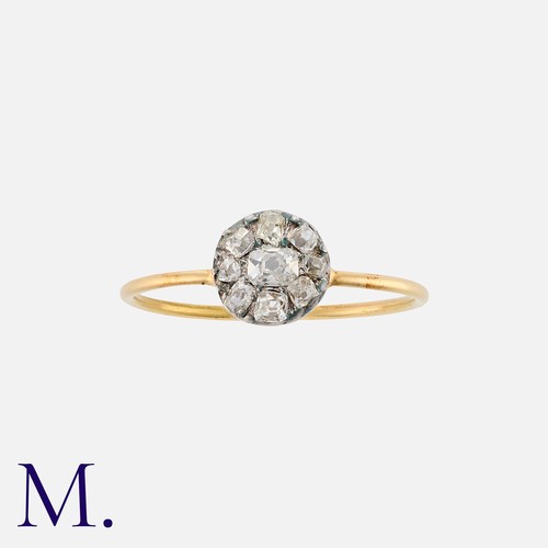 2 - A Diamond Cluster Ring in yellow gold and silver, comprising a cluster of old cut diamonds totalling... 