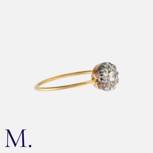 2 - A Diamond Cluster Ring in yellow gold and silver, comprising a cluster of old cut diamonds totalling... 