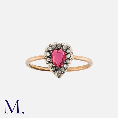 22 - A Spinel And Diamond Ring in yellow gold and silver, set with a heart shaped spinel of approximately... 