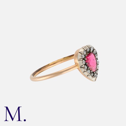 22 - A Spinel And Diamond Ring in yellow gold and silver, set with a heart shaped spinel of approximately... 