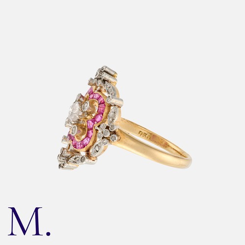 101 - An Art Deco Ruby And Diamond Cluster Ring in 18k yellow gold and platinum, set centrally with an old... 