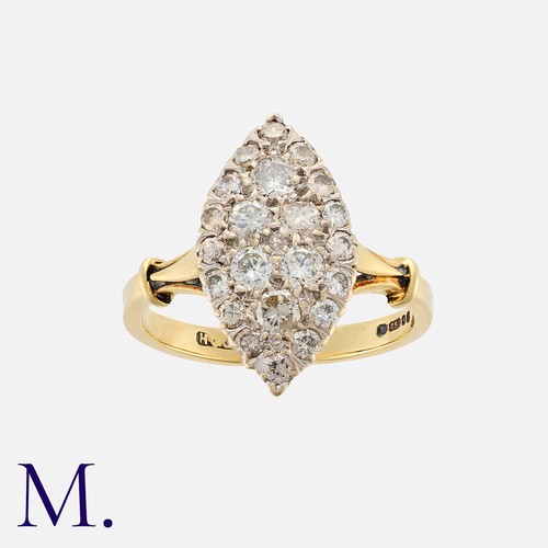 23 - A Vintage Diamond Navette Ring in 18k yellow gold, the navette shaped face set with round cut diamon... 