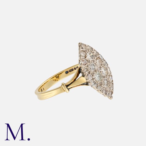 23 - A Vintage Diamond Navette Ring in 18k yellow gold, the navette shaped face set with round cut diamon... 