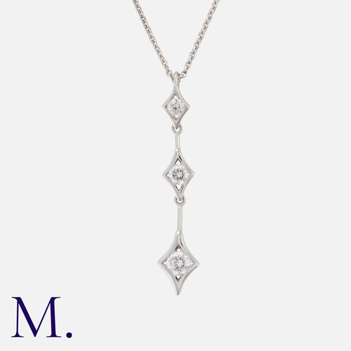 42 - DE BEERS, A Diamond Pendant Necklace in 18k white gold, comprising a trio of graduating round cut di... 