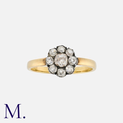 224 - A Diamond Cluster Ring in yellow gold and silver, comprising a cluster of old cut diamonds totalling... 