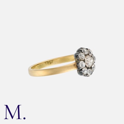 224 - A Diamond Cluster Ring in yellow gold and silver, comprising a cluster of old cut diamonds totalling... 