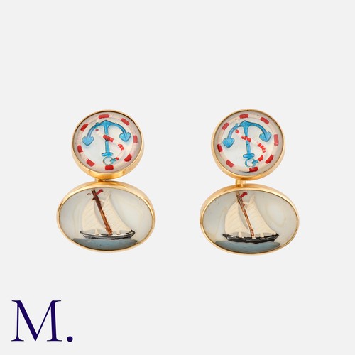 82 - A Pair Of Nautical Essex Crystal Cufflinks in 14k yellow gold, each comprising a reverse carved Esse... 