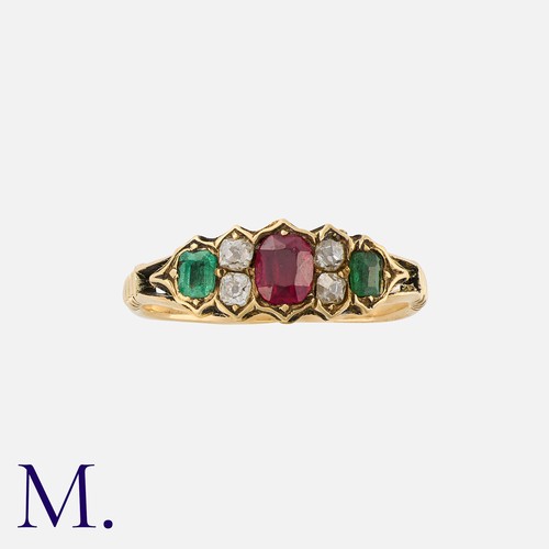 220 - A Ruby, Emerald And Paste Ring in yellow gold, set with a cushion cut ruby, flanked either side by p... 