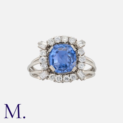 62 - A 4.36ct Colour Change Sapphire And Diamond Ring in white gold, set with a modified step cut sapphir... 