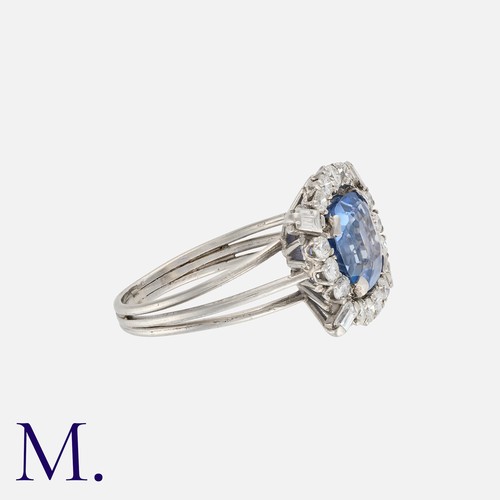 62 - A 4.36ct Colour Change Sapphire And Diamond Ring in white gold, set with a modified step cut sapphir... 