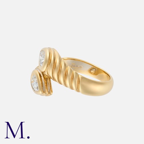 148 - BULGARI. A Diamond Doppio Ring in 18K yellow gold, set with two pear cut diamonds of approximately 0... 