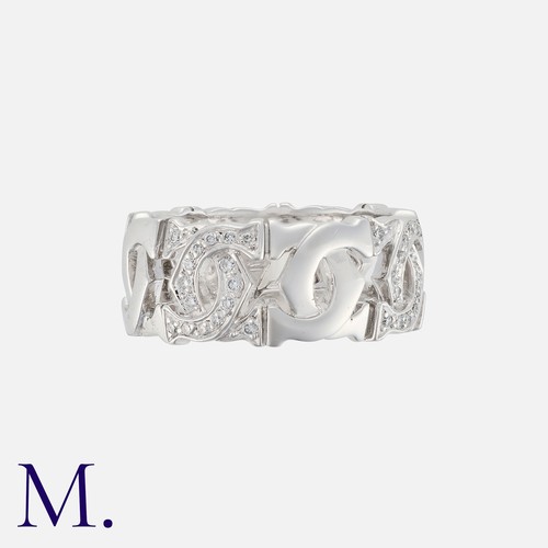 11 - CARTIER , A Diamond Set Double C Logo Ring in 18k white gold, comprising a series of interlocking C ... 