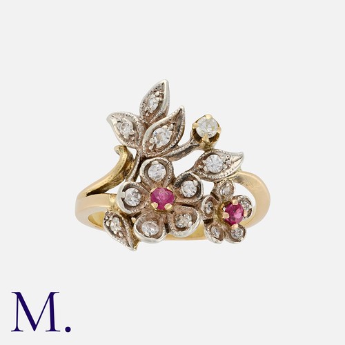 63 - A Ruby And Diamond Ring in yellow gold and silver, of foliate form set with round cut rubies and eig... 