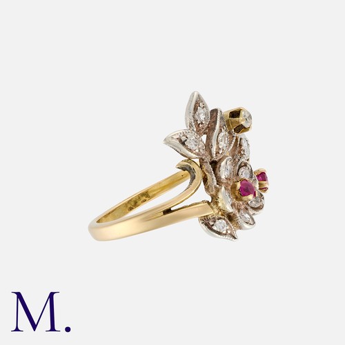 63 - A Ruby And Diamond Ring in yellow gold and silver, of foliate form set with round cut rubies and eig... 