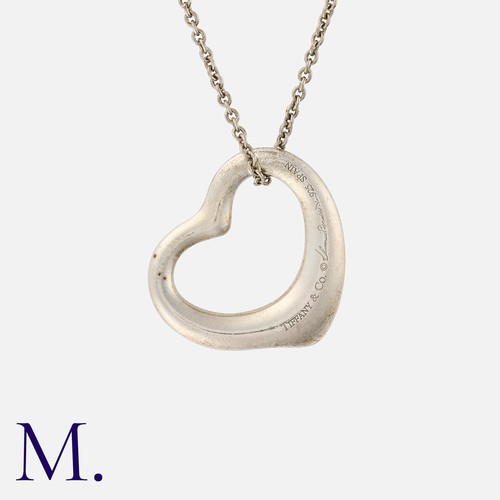 85 - TIFFANY & CO, An Open Heart Pendant By Elsa Peretti in silver, Designed as an open heart, on a fine ... 